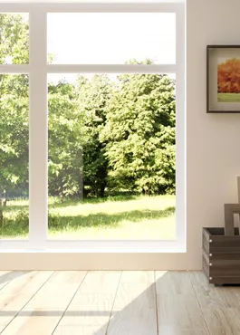 White-framed window with a clear single pane looking out over a stand of summer trees